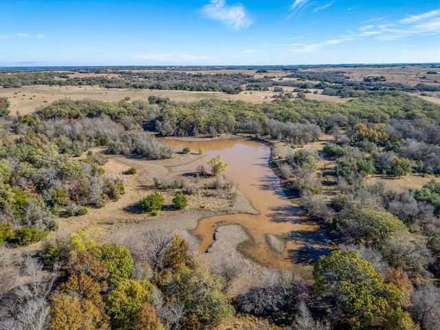 an aerial view of mountain with beach