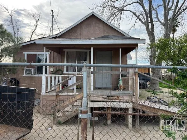 a backyard of a house with seating space