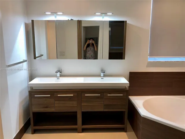 a bathroom with a sink and a bathtub