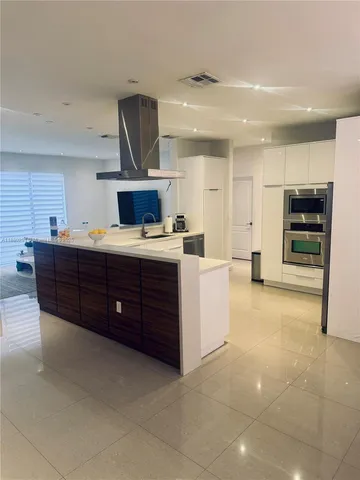 a room with a bed and a television in it