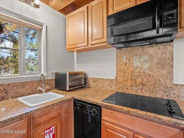 a kitchen with sink cabinets and window