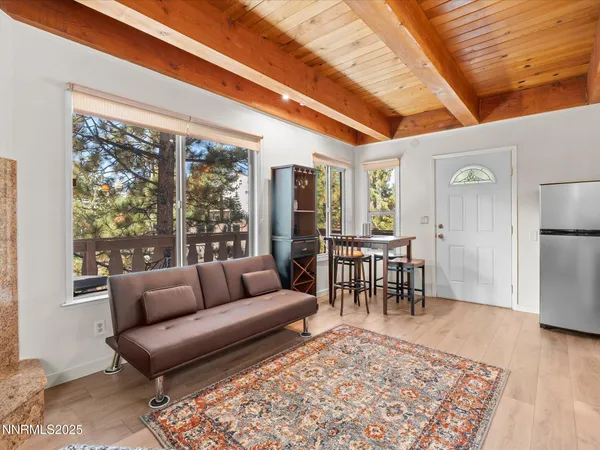 a living room with furniture and a rug