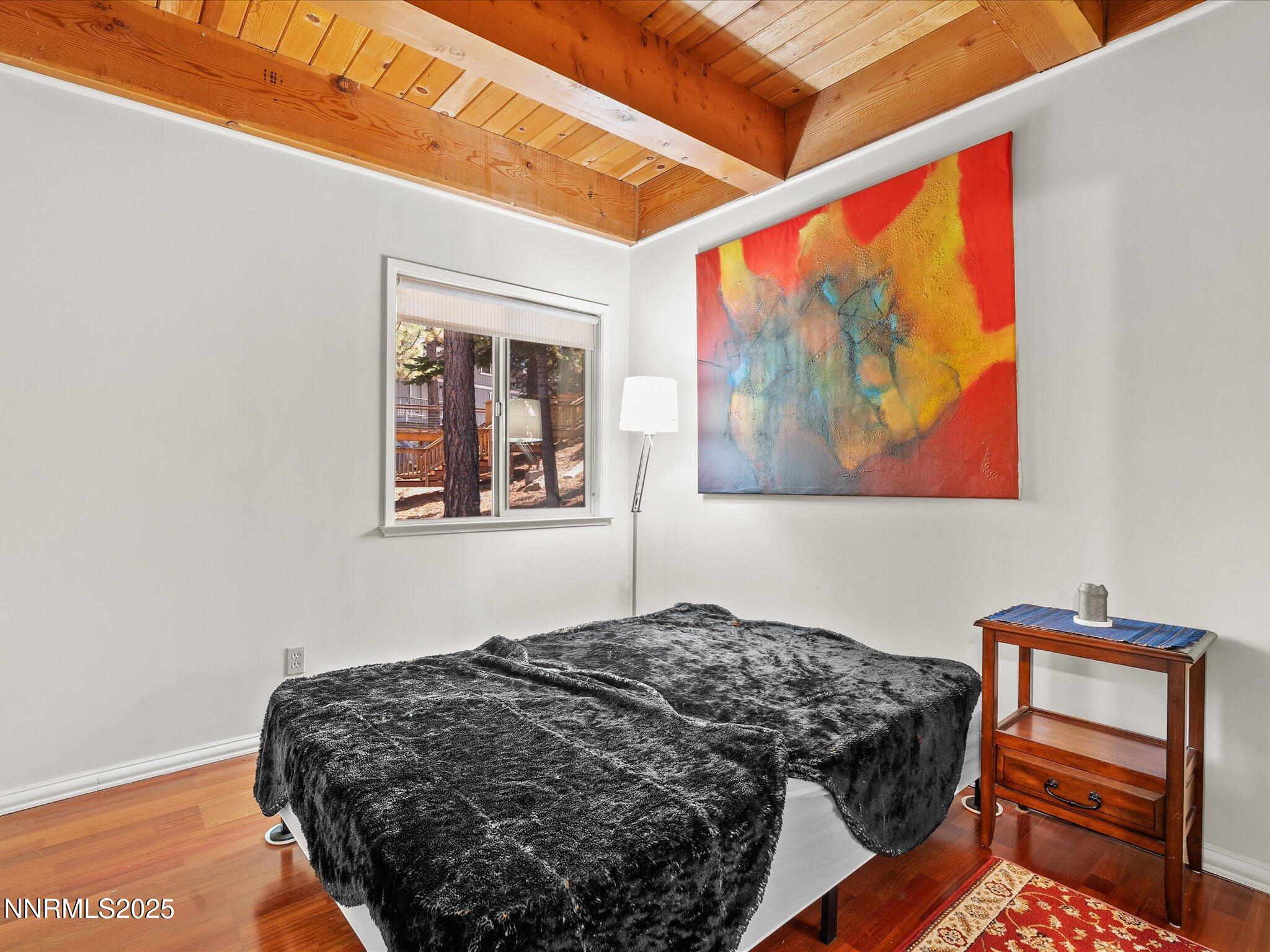 259 Tramway Drive, Unit 3 Stateline, NV 89449 - Photo 19 of 29 a bedroom with a bed and a window