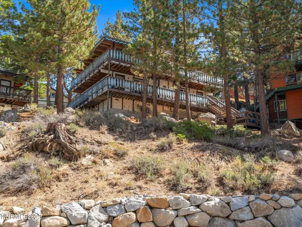 a tall building with trees in the background