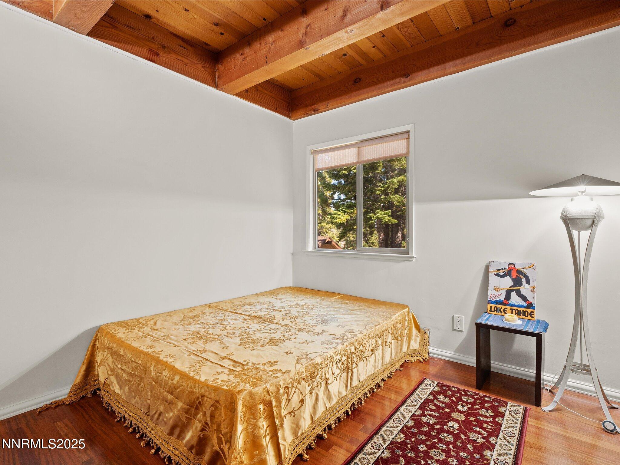 259 Tramway Drive, Unit 3 Stateline, NV 89449 - Photo 22 of 29 a bedroom with a bed and a window