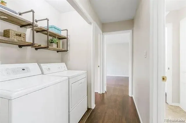 a view of storage and utility room with washer and dryer