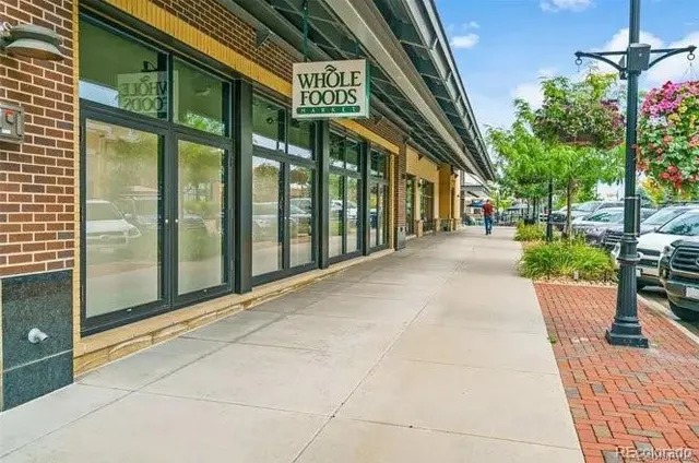 a view of a street with sitting area