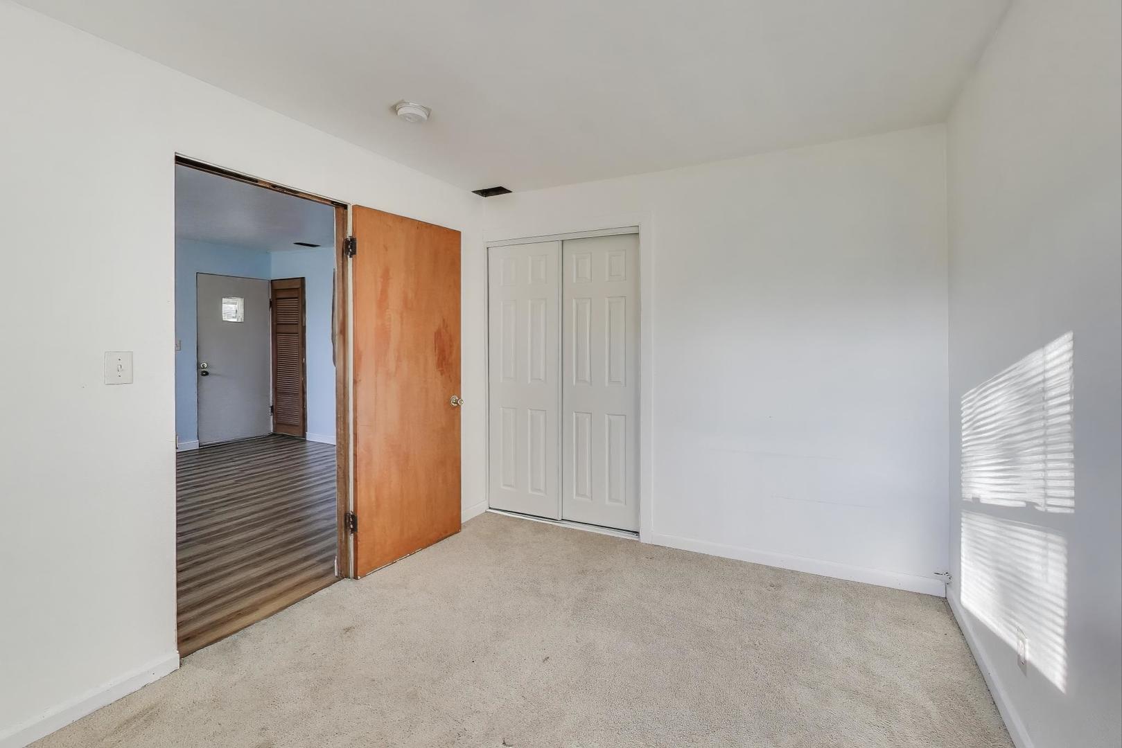 2524 Gilboa Avenue Zion, IL 60099 - Photo 20 of 33 a view of a hallway with wooden floor and closet area