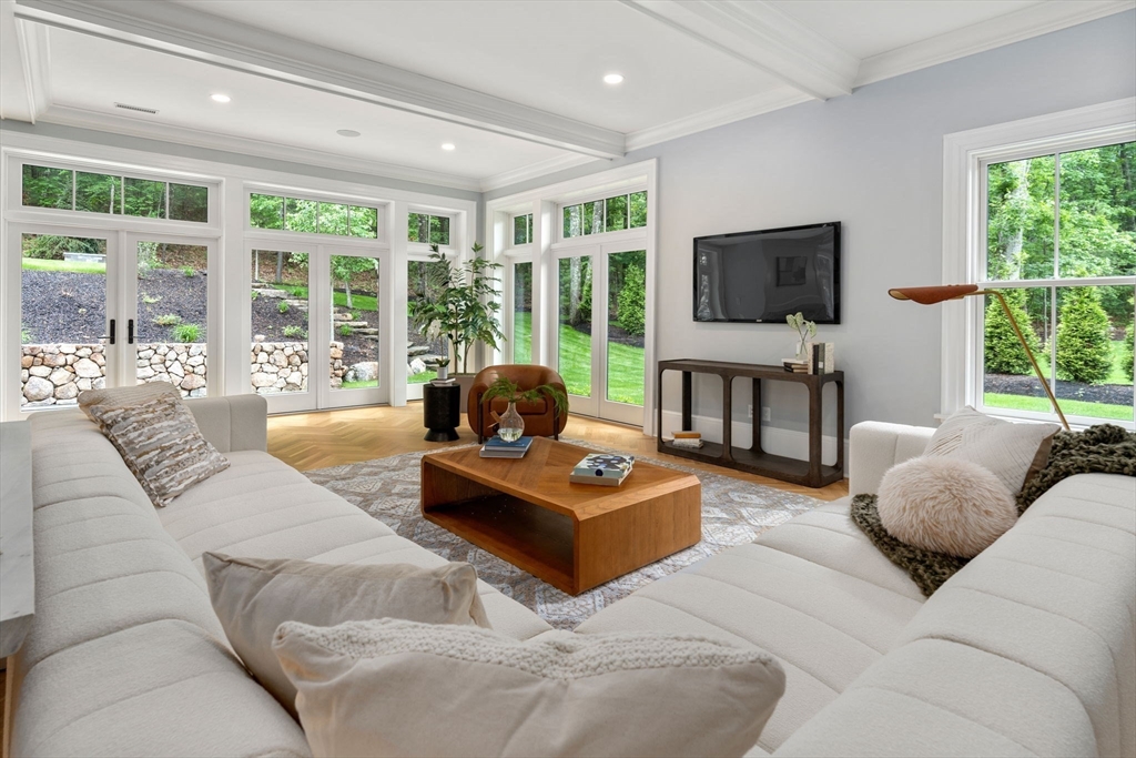196 Pond Road Wellesley, MA 02482 - Photo 13 of 20 a living room with furniture a flat screen tv and a large window