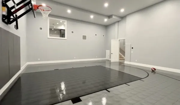 an empty room with wooden floor