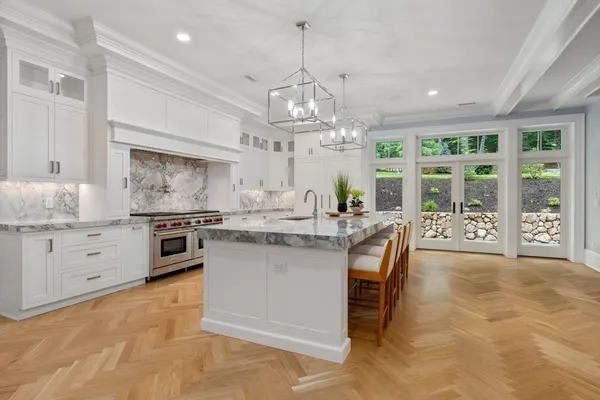 a view of living room with kitchen island granite countertop furniture and fireplace