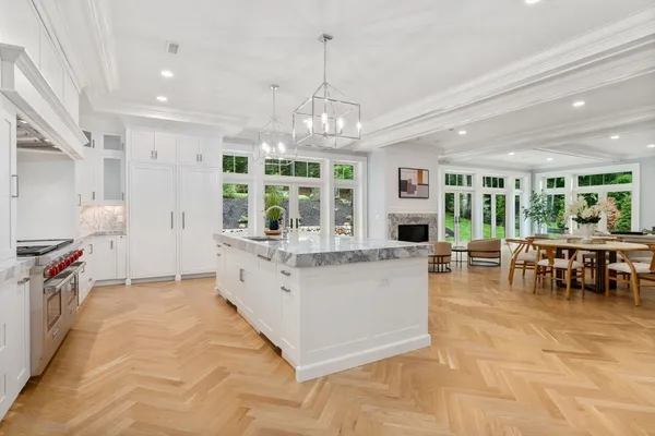 a kitchen with stainless steel appliances granite countertop a stove and a sink