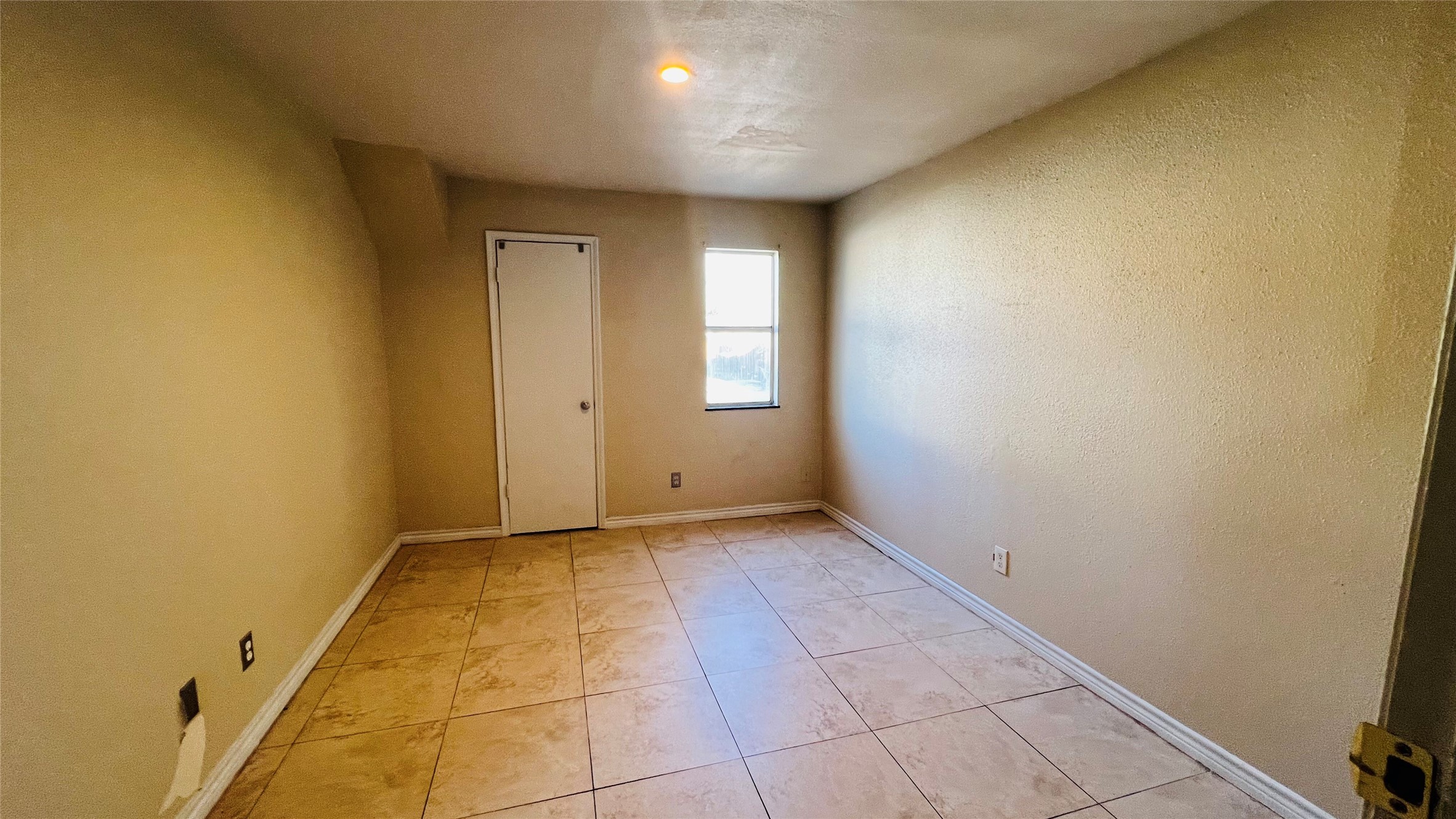 12222 Wild Pine Drive, Unit C Houston, TX 77039 - Photo 2 of 9 an empty room with windows