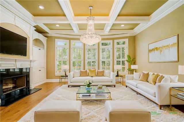 wooden floor in an empty room with a fireplace