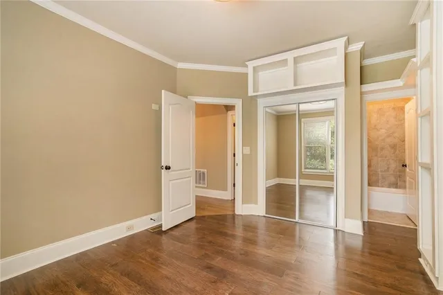 a bathroom with a black and white checkered floor