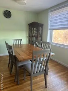 a view of a dining room with furniture and window