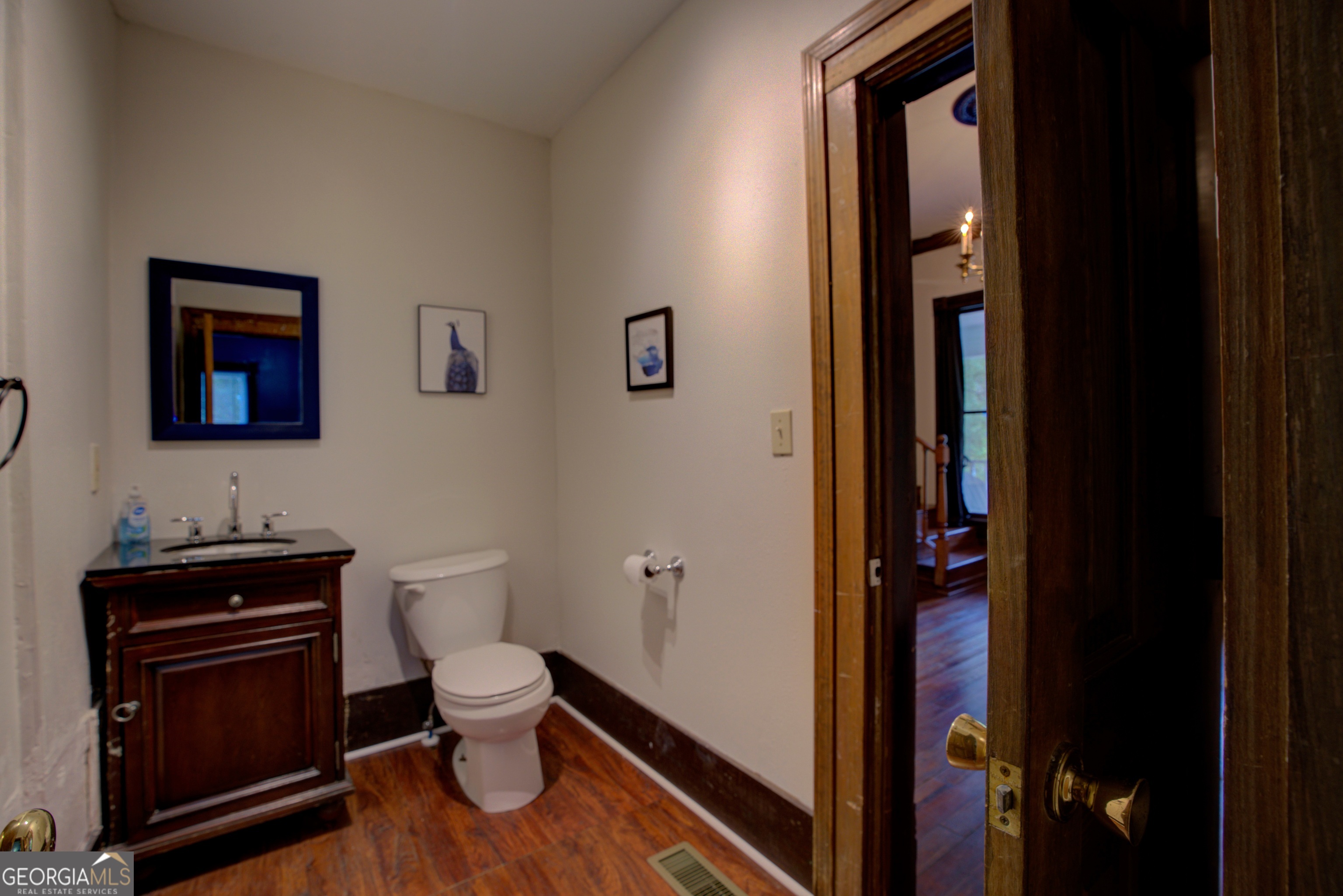 232 South Broad Street Rome, GA 30161 - Photo 15 of 37 a bathroom with a toilet and a sink