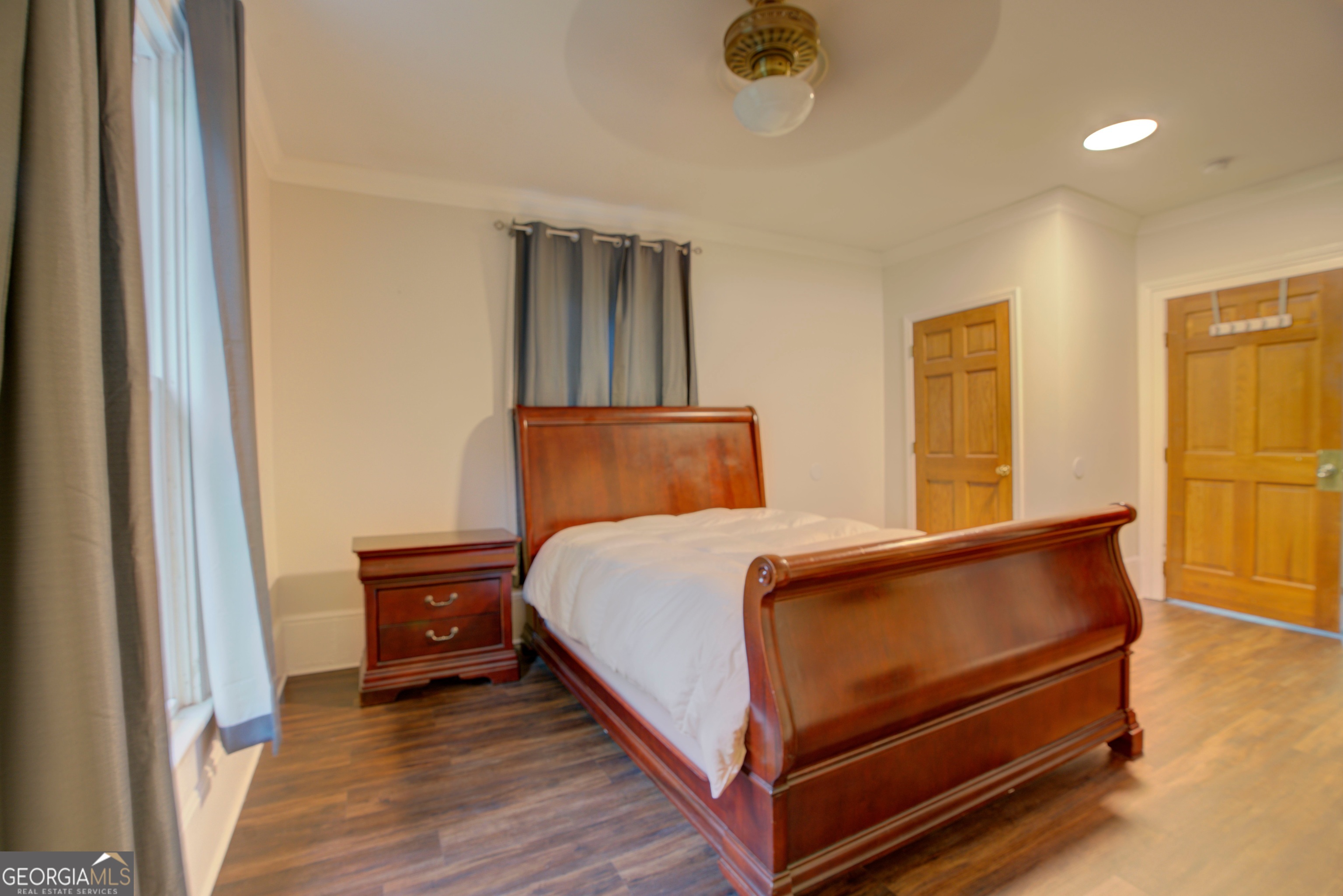 232 South Broad Street Rome, GA 30161 - Photo 22 of 37 a bedroom with a bed and wooden floor