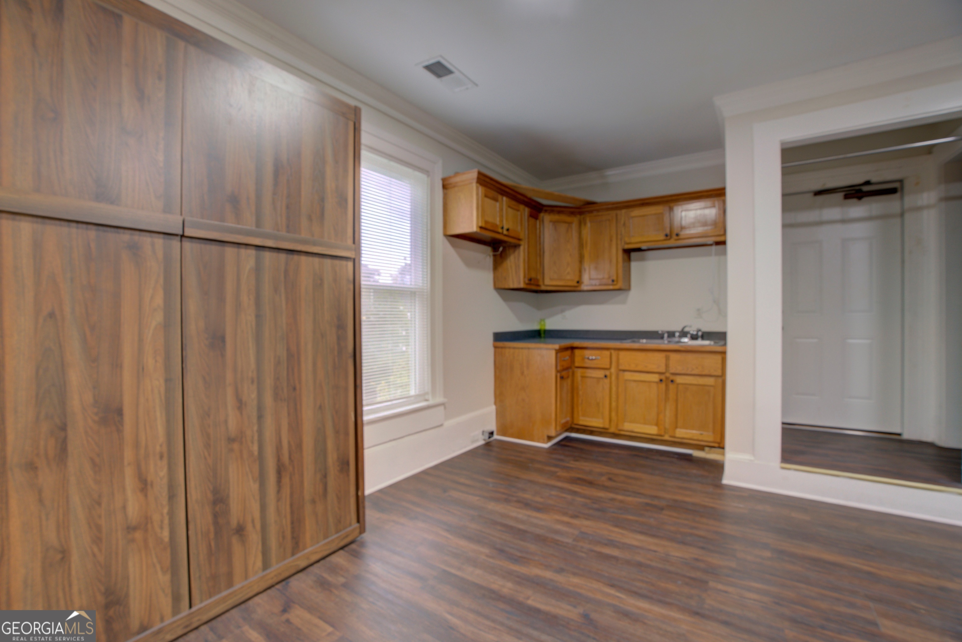 232 South Broad Street Rome, GA 30161 - Photo 24 of 37 a view of kitchen with wooden floor and electronic appliances
