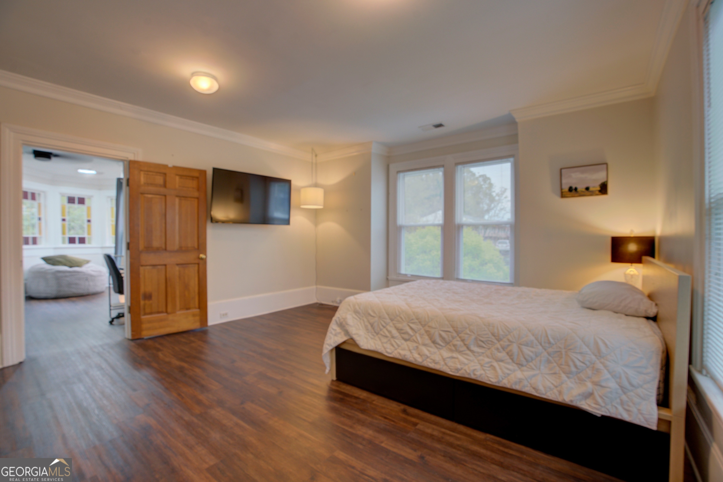 232 South Broad Street Rome, GA 30161 - Photo 26 of 37 a bedroom with a bed and wooden floor