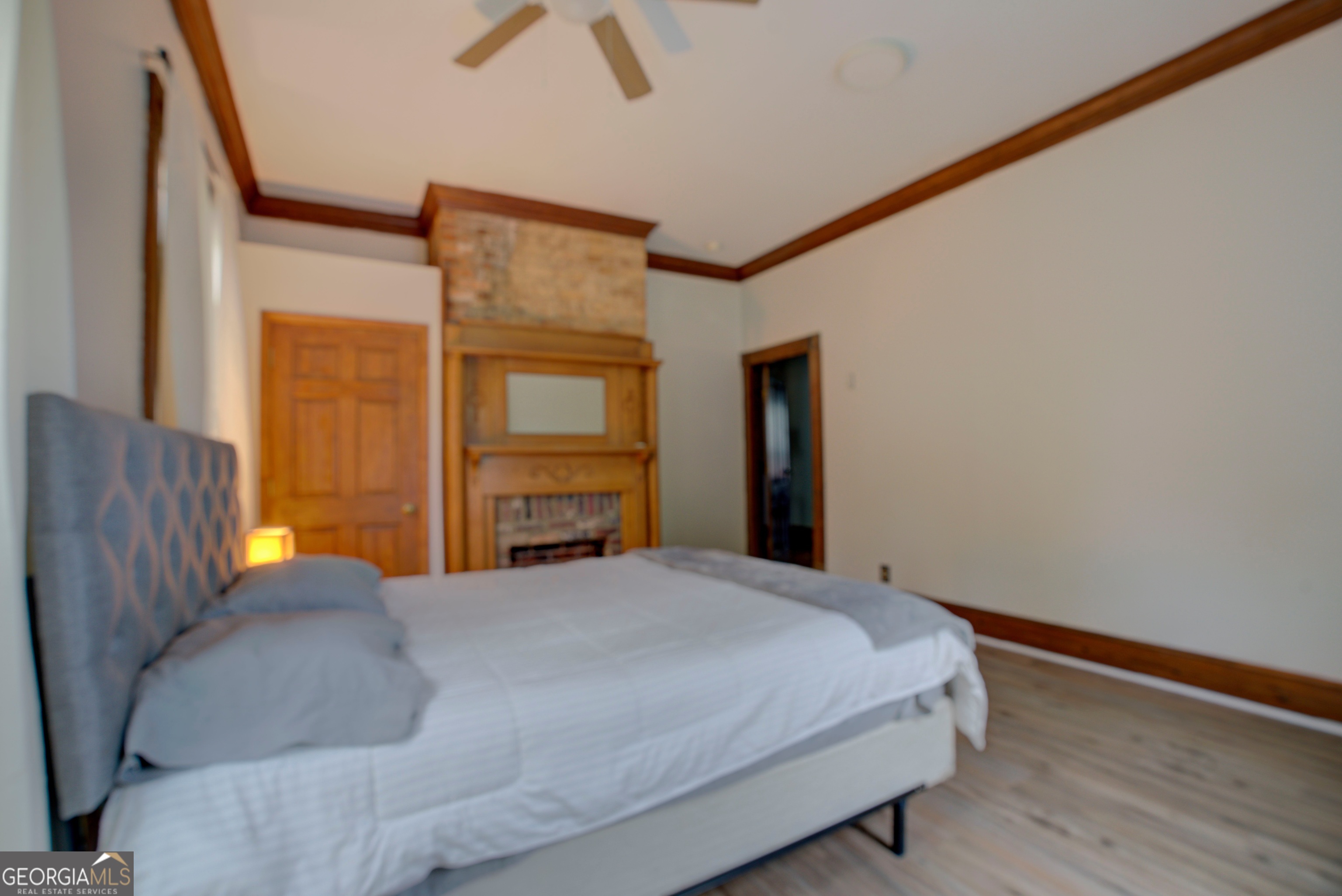 232 South Broad Street Rome, GA 30161 - Photo 32 of 37 a bedroom with a bed and wooden floor