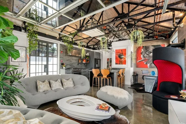 a living room with furniture and a window