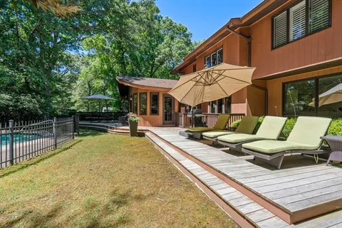 a view of a patio with chairs and a table