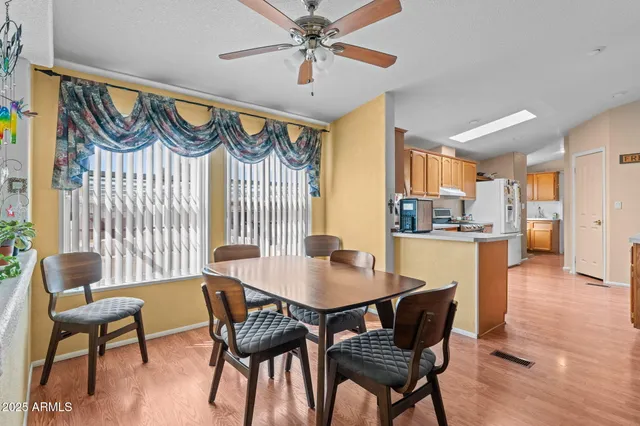 a dining room with furniture and window