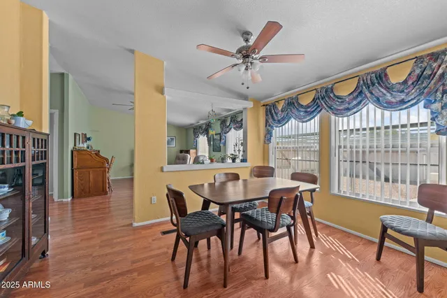 a view of a dining room with furniture window and wooden floor