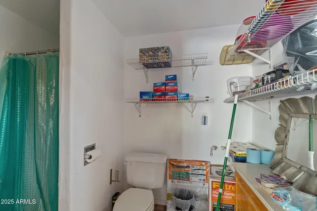 a room with wooden cabinets and a wooden floor