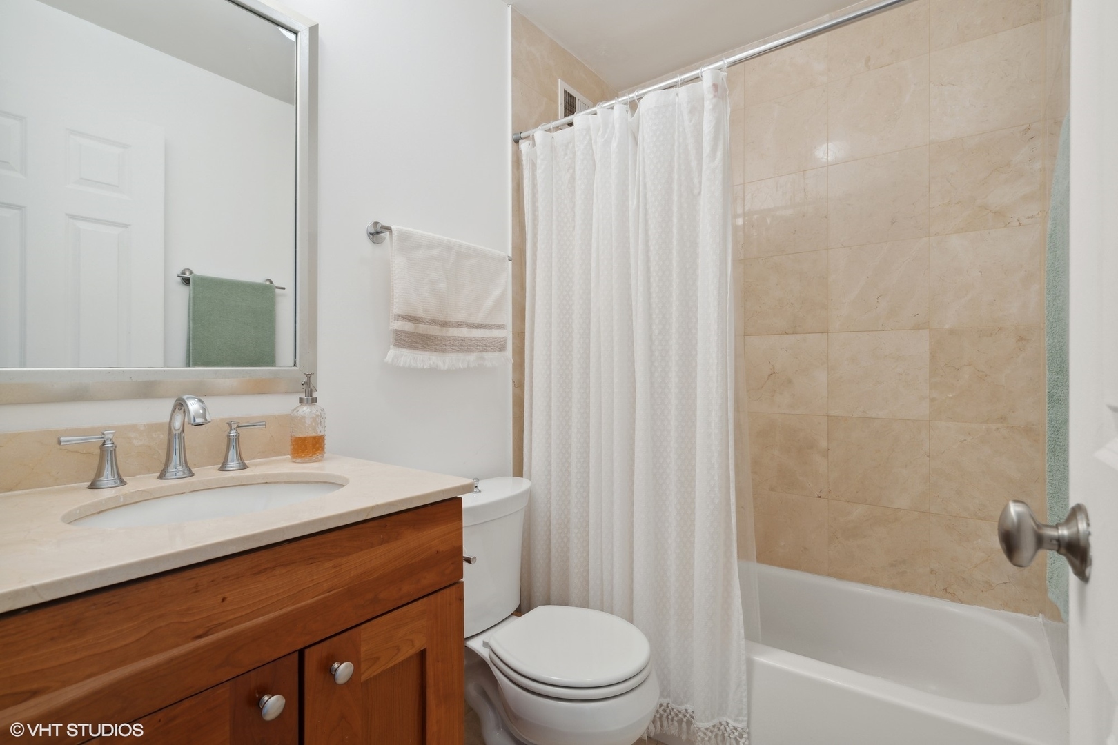 450 West Briar Place, Unit 7B Chicago, IL 60657 - Photo 12 of 15 a bathroom with a sink a toilet and shower