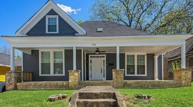 front view of a house with a yard