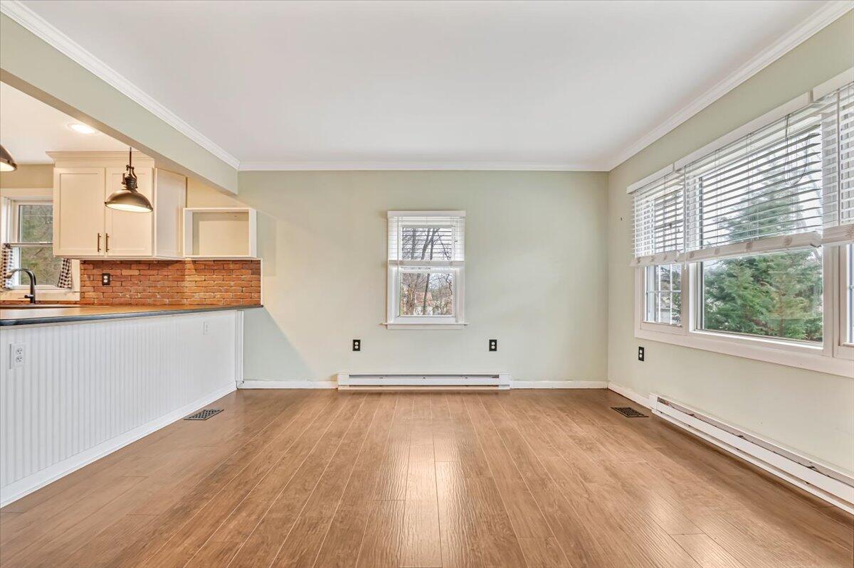 5039 Running Valley Road Stroudsburg, PA 18360 - Photo 13 of 65 an empty room with wooden floor and windows