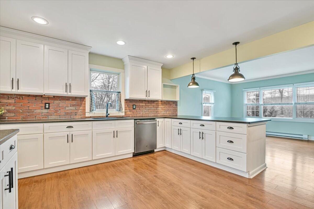 5039 Running Valley Road Stroudsburg, PA 18360 - Photo 17 of 65 a kitchen with granite countertop white cabinets and white appliances