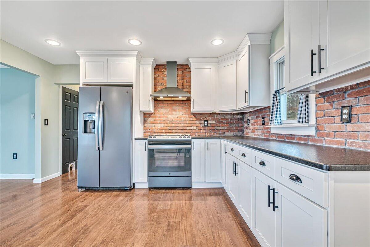 5039 Running Valley Road Stroudsburg, PA 18360 - Photo 20 of 65 a kitchen with stainless steel appliances granite countertop a refrigerator and a sink