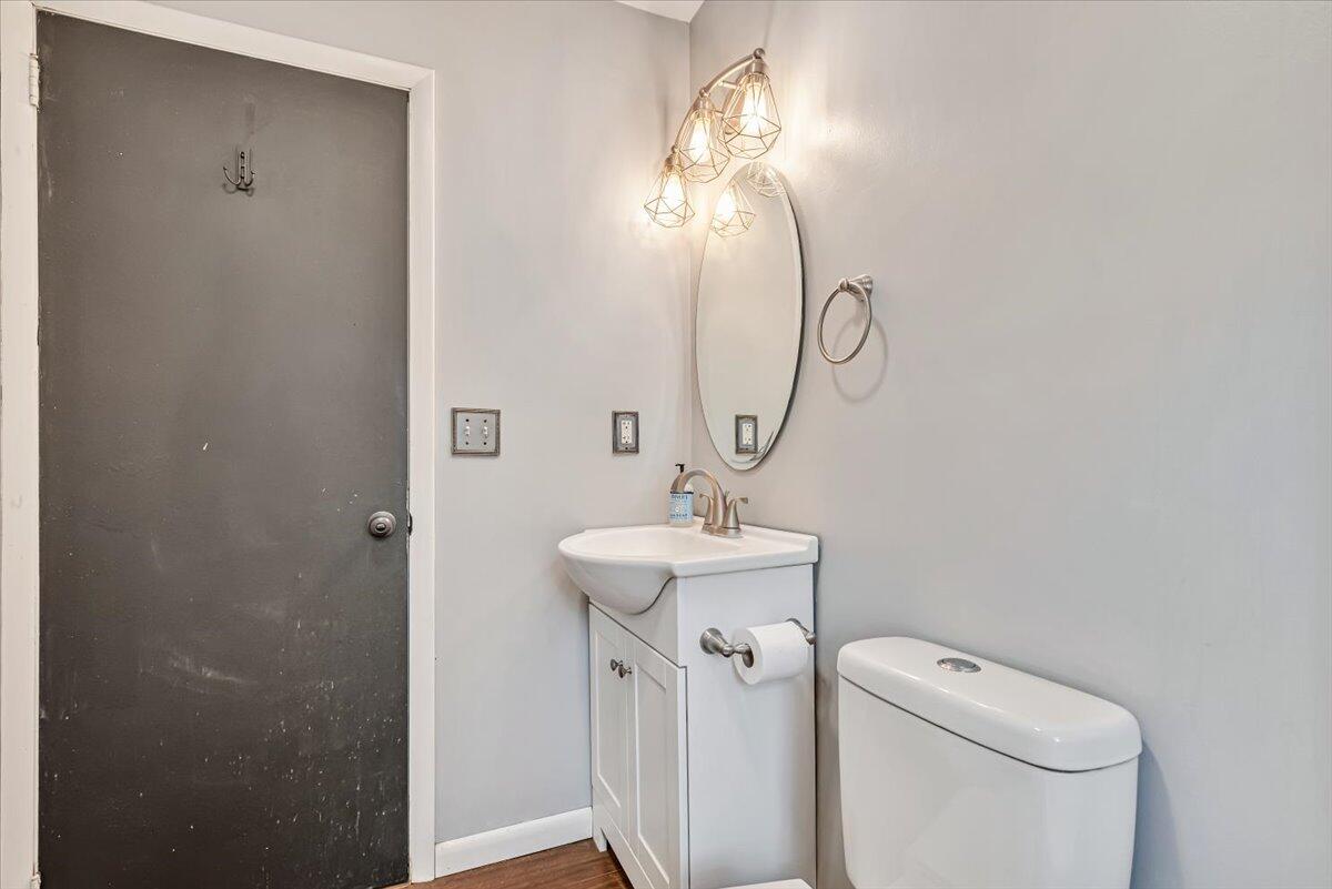 5039 Running Valley Road Stroudsburg, PA 18360 - Photo 28 of 65 a bathroom with a toilet sink and mirror