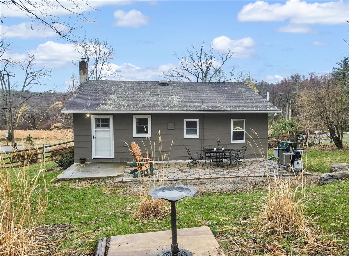 5039 Running Valley Road Stroudsburg, PA 18360 - Photo 40 of 65 a front view of house with yard and patio