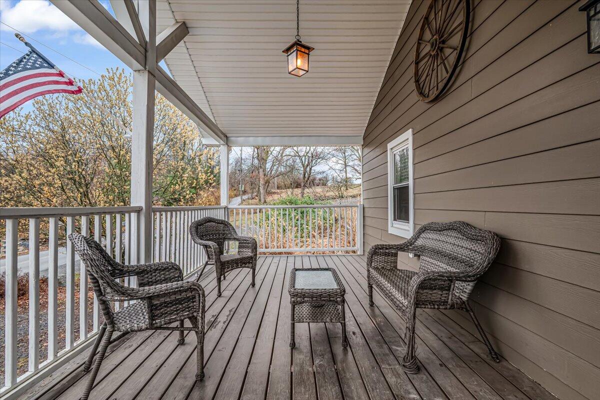 5039 Running Valley Road Stroudsburg, PA 18360 - Photo 4 of 65 a view of a chairs in wooden deck