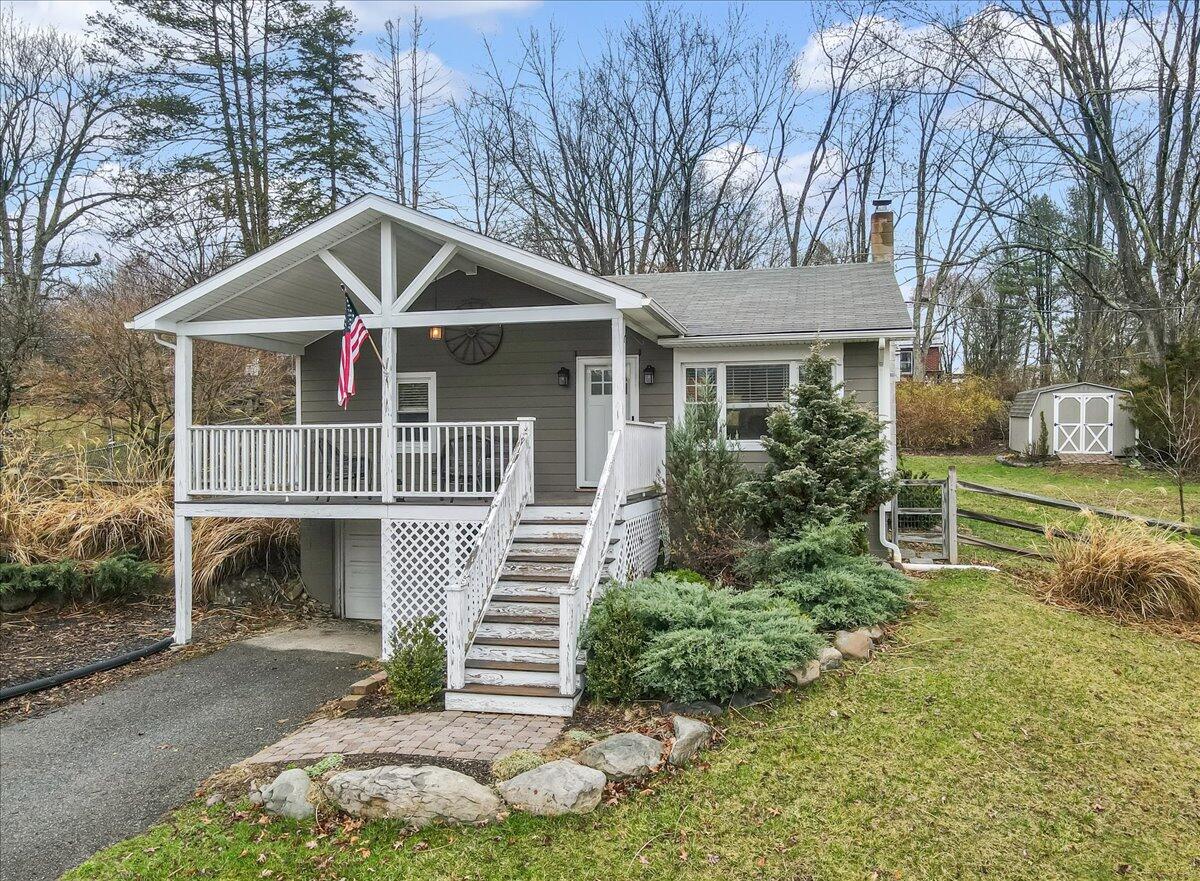 5039 Running Valley Road Stroudsburg, PA 18360 - Photo 53 of 65 a front view of a house with garden