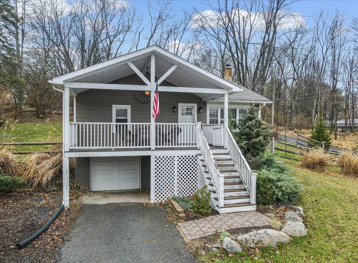5039 Running Valley Road Stroudsburg, PA 18360 - Photo 55 of 65 a front view of a house with garden