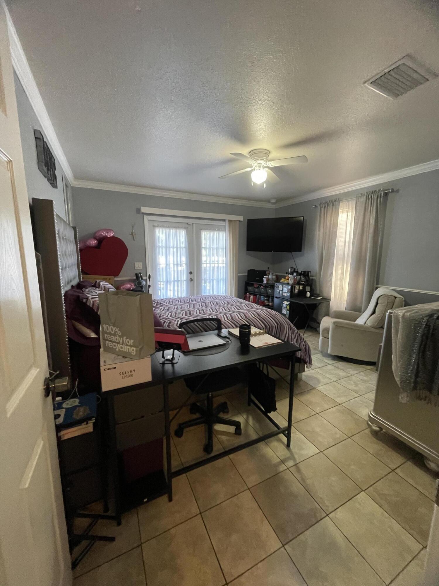 1220 A Road LaBelle, FL 33935 - Photo 25 of 42 a room with furniture a rug and a window