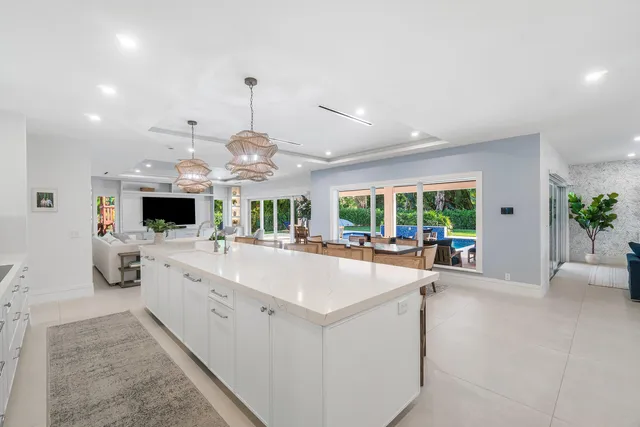 a bathroom with a toilet sink vanity and mirror