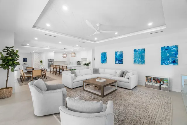 a bathroom with a granite countertop toilet sink and mirror