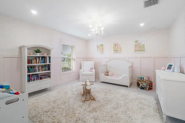 a bedroom with a bed and a ceiling fan