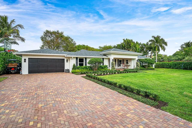 a view of a house with patio front of house