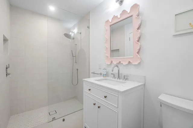 a spacious bedroom with a large bed and a large window