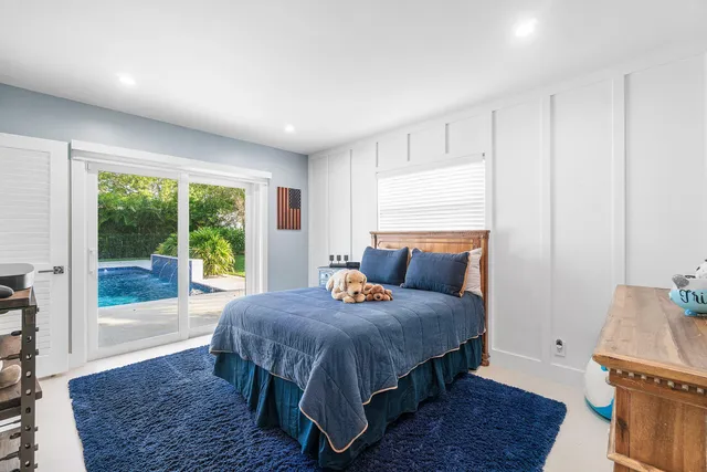 an aerial view of residential houses with outdoor space and street view