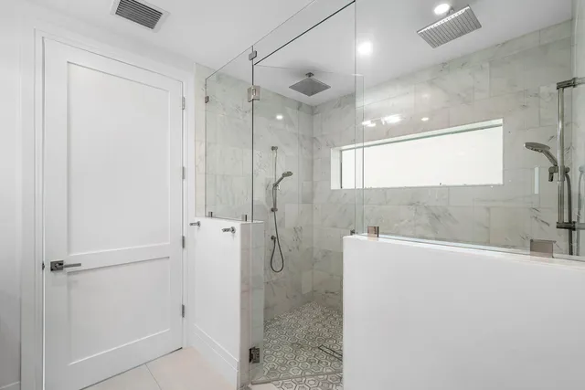 an aerial view of residential houses with outdoor space and street view