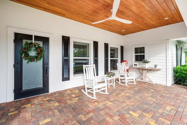 a view of a livingroom with furniture and a flat screen tv