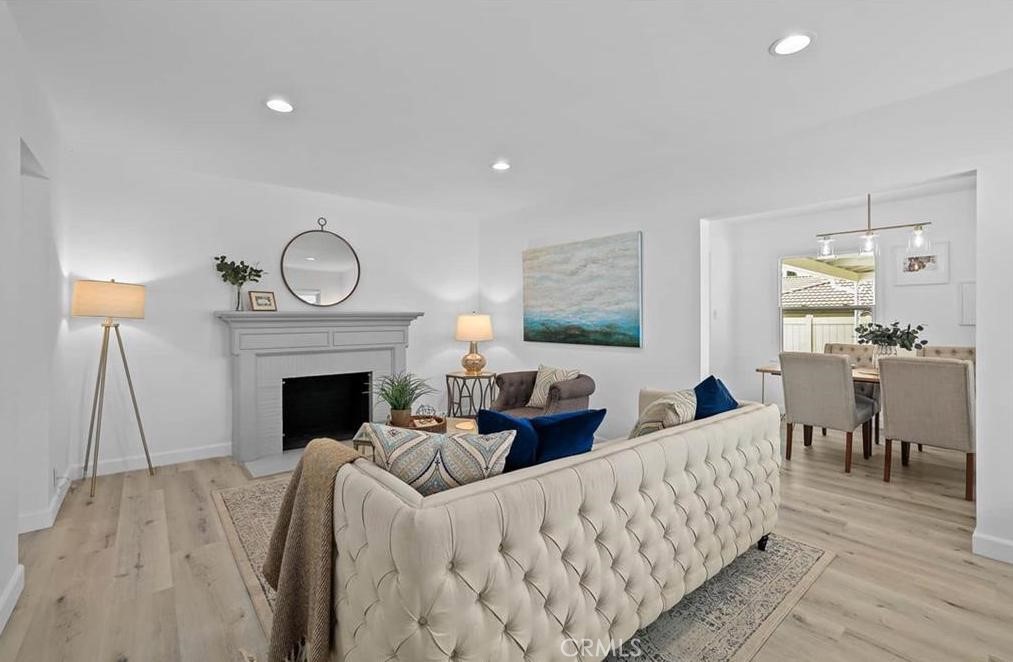100 Eastern Pasadena, CA 91107 - Photo 4 of 18 a living room with furniture a fireplace and a table